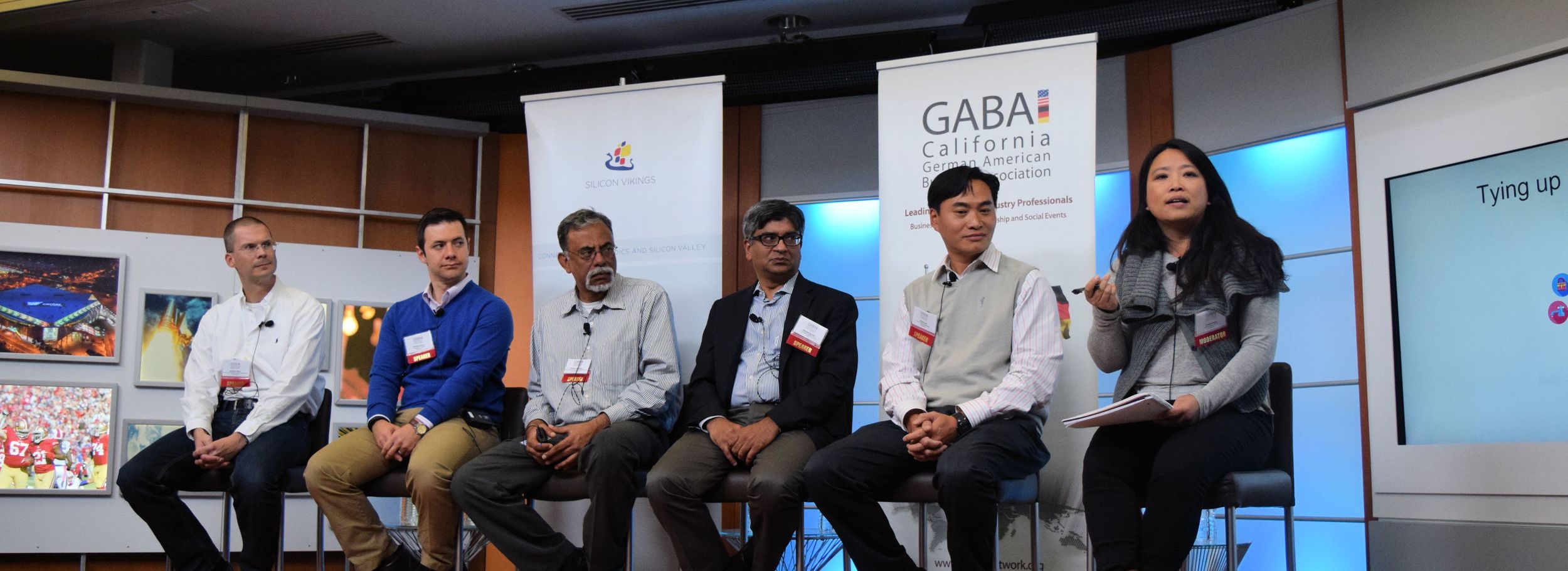 Panel of people answering questions at a partnership event
