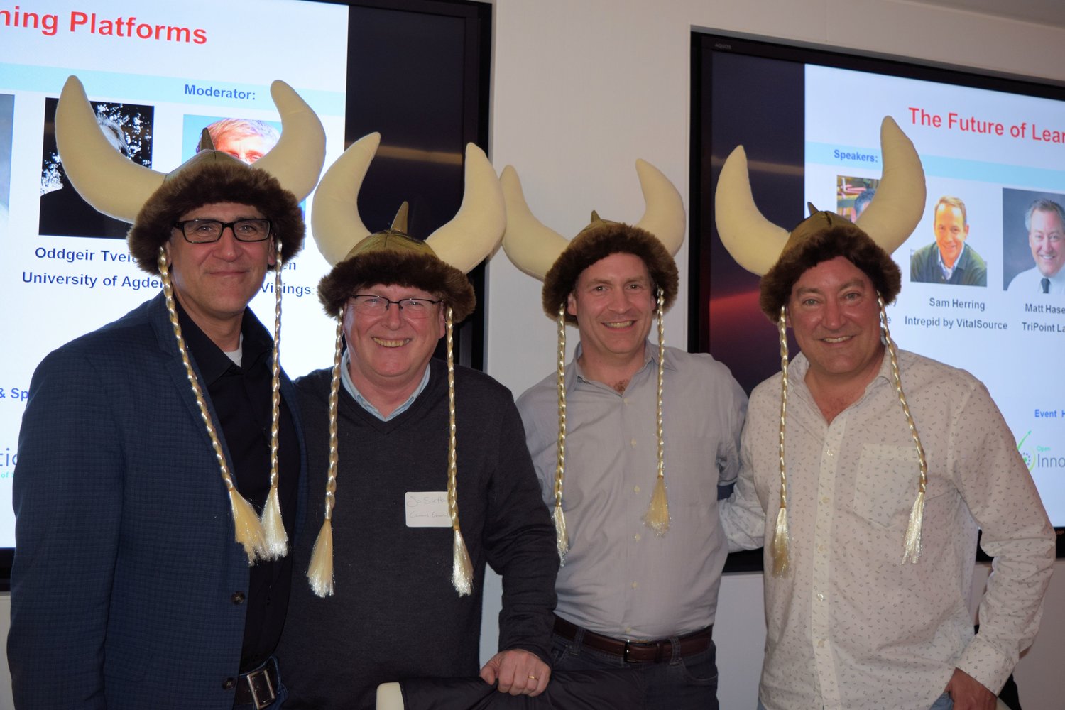 Four men in hats standing around